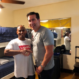 James standing with The Encounter's CEO in the transition home