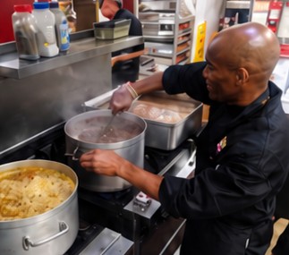 James cooking in a commercial kitchen